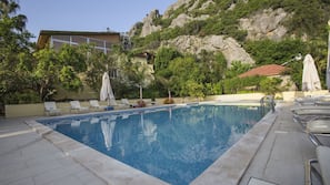 Outdoor pool, pool umbrellas, pool loungers