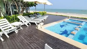 Outdoor pool, pool umbrellas, sun loungers
