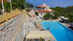 Seasonal outdoor pool, pool loungers