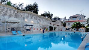 Seasonal outdoor pool, pool loungers