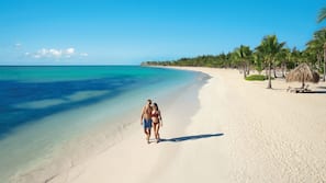 On the beach, white sand, beach towels
