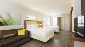 Hypo-allergenic bedding, desk, laptop workspace, blackout drapes
