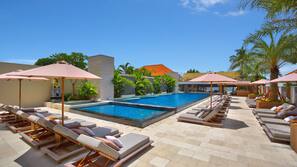 2 outdoor pools, open 7:00 AM to 10:00 PM, pool umbrellas, pool loungers