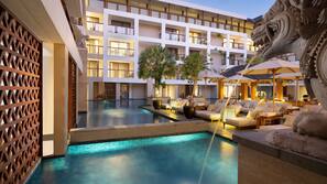 2 outdoor pools, open 7:00 AM to 10:00 PM, pool umbrellas, pool loungers