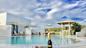 Seasonal outdoor pool, pool umbrellas, sun loungers