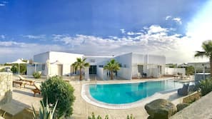 Seasonal outdoor pool, pool umbrellas, sun loungers