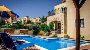 Seasonal outdoor pool, pool umbrellas, pool loungers