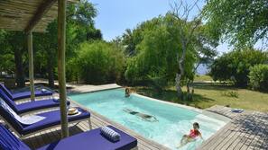 Outdoor pool, an infinity pool, sun loungers