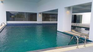 Outdoor pool, open 7:00 AM to 7:00 PM, pool umbrellas, pool loungers