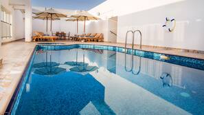 Outdoor pool, open 8 AM to 8 PM, pool umbrellas, sun loungers