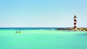 On the beach, beach cabanas, sun-loungers, beach umbrellas