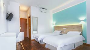 Escritorio, cortinas opacas, wifi gratis y ropa de cama