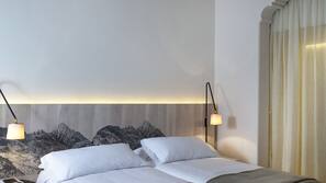 Premium bedding, pillow top beds, minibar, in-room safe
