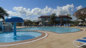 Outdoor pool, pool umbrellas, sun loungers