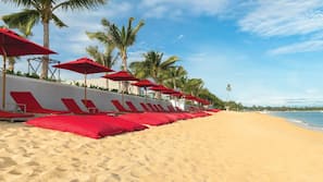 On the beach, sun-loungers, beach umbrellas, beach towels