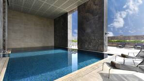 Outdoor pool, pool umbrellas, sun loungers