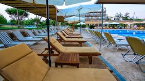 Seasonal outdoor pool, pool umbrellas, pool loungers