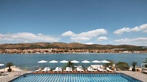 Indoor pool, seasonal outdoor pool, free pool cabanas, pool umbrellas