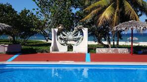 Outdoor pool, open 9:30 AM to 6:30 PM, pool umbrellas, sun loungers