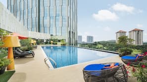 Outdoor pool, open 7:00 AM to 8:00 PM, pool loungers
