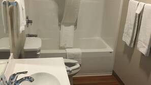 Combined shower/tub, rainfall showerhead, free toiletries, hair dryer