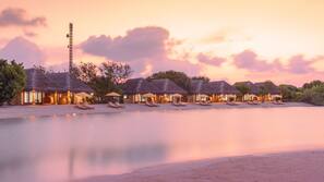 On the beach, white sand, beach umbrellas, beach towels