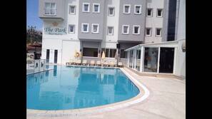 Outdoor pool, pool umbrellas, pool loungers