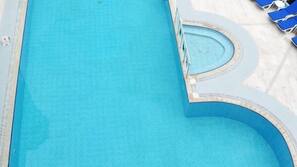Outdoor pool, pool umbrellas, pool loungers
