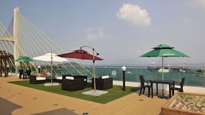 Seasonal outdoor pool, open 1:30 PM to 9:00 PM, pool umbrellas