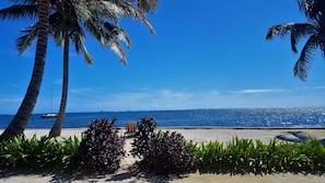 On the beach, sun loungers, beach towels