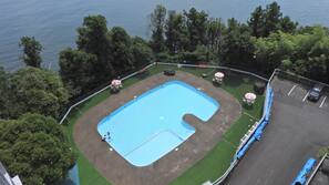 Seasonal outdoor pool, open 9:00 AM to 5:00 PM, pool umbrellas