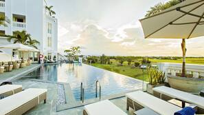 Outdoor pool, pool umbrellas, sun loungers