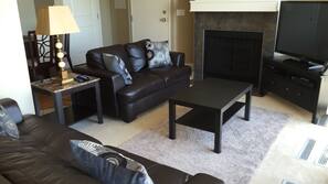 50-inch flat-screen TV with satellite channels, fireplace, pay movies