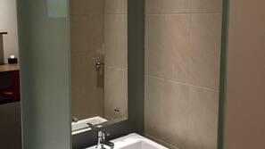 Shower, free toiletries, slippers