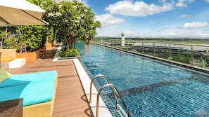 Outdoor pool, open 6 AM to 8 PM, pool umbrellas, pool loungers
