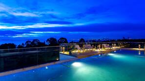 2 outdoor pools, open 7 AM to 8 PM, pool umbrellas