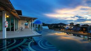 2 outdoor pools, open 7 AM to 8 PM, pool umbrellas