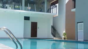 Outdoor pool, pool umbrellas, sun loungers