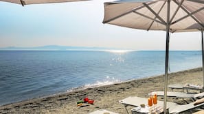 On the beach, sun-loungers, beach umbrellas, beach towels