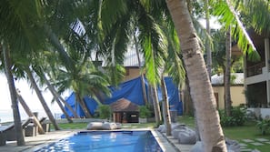 Outdoor pool, pool umbrellas, sun loungers