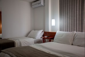 Standard Triple Room | Minibar, laptop workspace, free WiFi, bed sheets