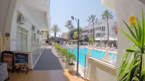 2 outdoor pools, open 8:00 AM to 8:00 PM, pool umbrellas, pool loungers