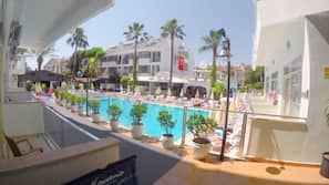 2 outdoor pools, open 8:00 AM to 8:00 PM, pool umbrellas, pool loungers