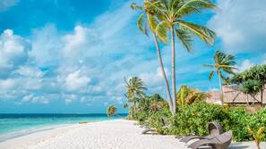 Private beach, white sand, sun loungers, beach umbrellas