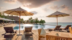 Outdoor pool, free cabanas, pool umbrellas