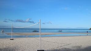 On the beach, sun loungers, beach bar