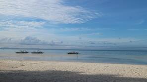 On the beach, sun loungers, beach bar