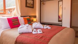 1 dormitorio y tabla de planchar con plancha