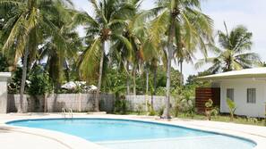 Outdoor pool, pool umbrellas, sun loungers
