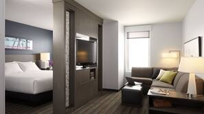 Hypo-allergenic bedding, desk, laptop workspace, blackout drapes
